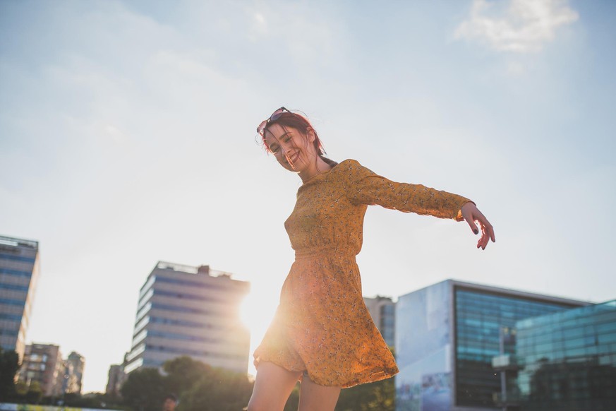 Happy Young Woman Enjoying Sunny Day Outdoors