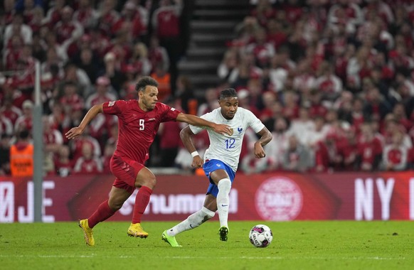 September 25, 2022: Christopher Nkunku France and Martin Braithwaite Denmark battle for the ball during Denmark and France at Parken, Copenhagen, Denmark. Ulrik Pedersen/CSM. Copenhagen Denmark - ZUMA ...