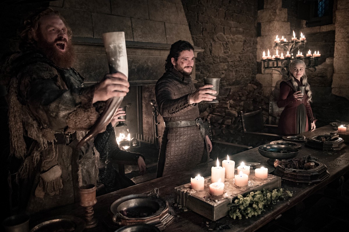 This image released by HBO shows Kristofer Hivju, from left, Kit Harington and Emilia Clarke in a scene from "Game of Thrones." fans got a taste of the modern world when eagle-eyed viewers s ...