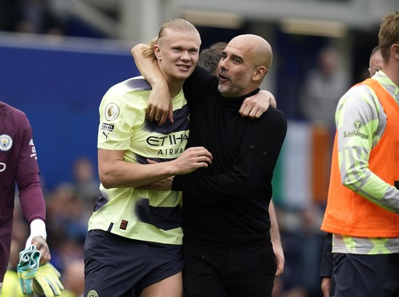 Liverpool, England, 14th May 2023. Josep Guardiola manager of Manchester City r hugs Erling Haaland of Manchester City at the final whistle during the Premier League match at Goodison Park, Liverpool. ...