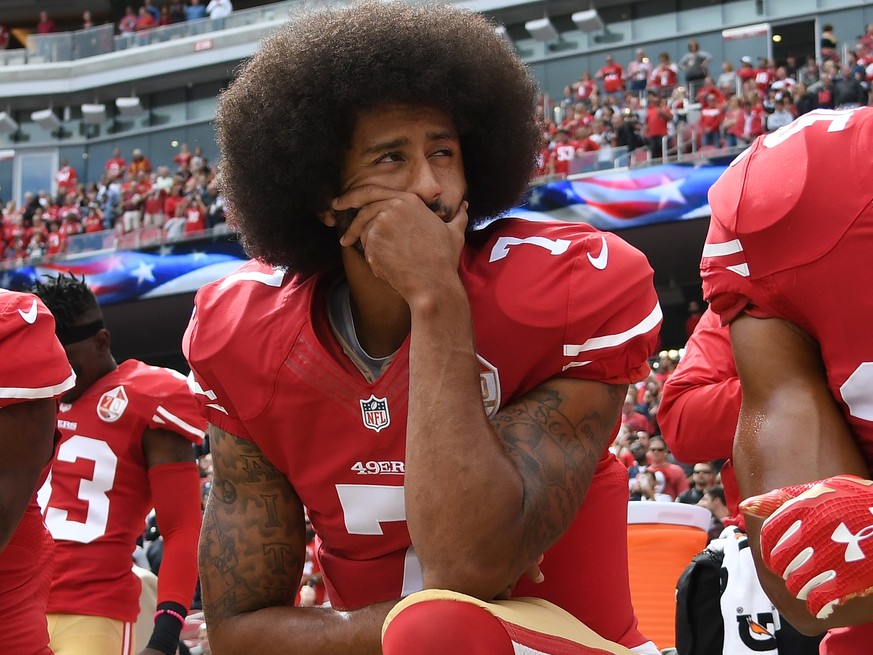 SANTA CLARA, CA - OCTOBER 02: Colin Kaepernick #7 of the San Francisco 49ers kneels on the sideline during the anthem prior to the game against the Dallas Cowboys at Levi&#039;s Stadium on October 2,  ...