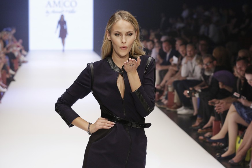 DUESSELDORF, GERMANY - JULY 24: Model Elena Carriere blows a kiss as she walks the runway for AMCO by Annett Moeller as part of the Platform Fashion Selected show during Platform Fashion July 2016 at  ...