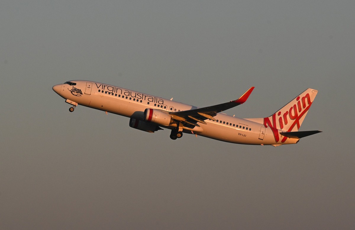 VIRGIN AUSTRALIA STOCK, A Virgin Australia aircraft is seen at dusk departing from Brisbane Airport in Brisbane, Friday , August 30, 2024. ACHTUNG: NUR REDAKTIONELLE NUTZUNG, KEINE ARCHIVIERUNG UND KE ...