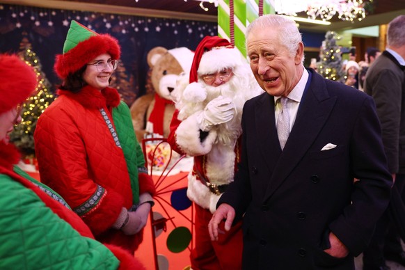 King Charles III Visits Ealing Broadway Shopping Centre LONDON, ENGLAND - DECEMBER 7: King Charles III visits Ealing Broadway Shopping Centre to tour the Christmas Market, meet local business owners a ...