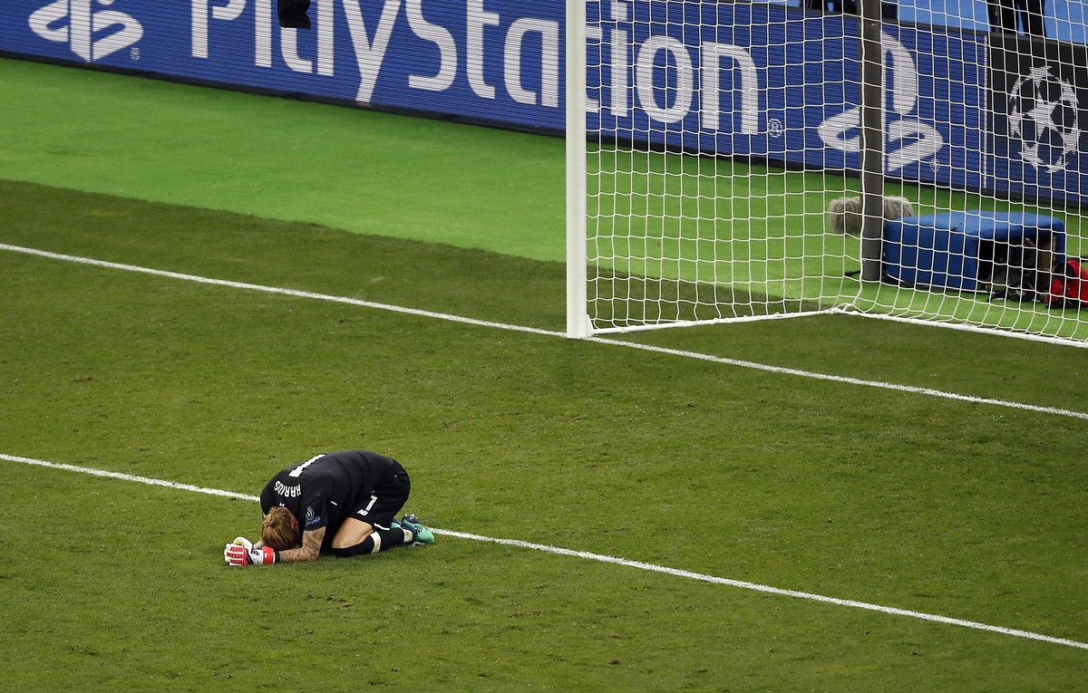 Liverpool goalkeeper Loris Karius reacts after the Champions League Final soccer match between Real Madrid and Liverpool at the Olimpiyskiy Stadium in Kiev, Ukraine, Saturday, May 26, 2018. (AP Photo/ ...