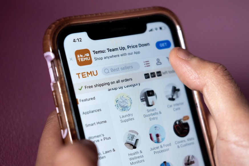 April 4, 2023, Toronto, ON, CANADA: A person navigates the Temu website on a smartphone in Toronto, Tuesday, April 4, 2023. Temu launched in Canada in early February -- the same month it aired a Super ...