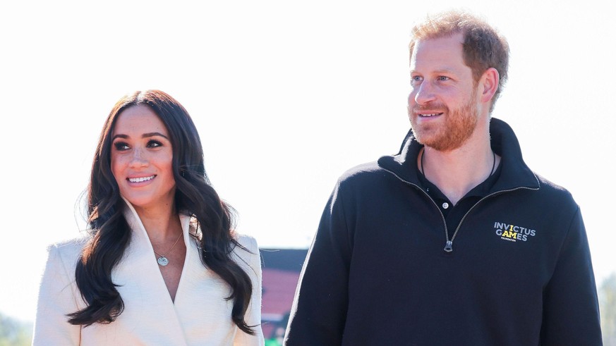 THE HAGUE, NETHERLANDS - APRIL 17: Prince Harry, Duke of Sussex and Meghan, Duchess of Sussex attend the Athletics Competition during day two of the Invictus Games The Hague 2020 at Zuiderpark on Apri ...