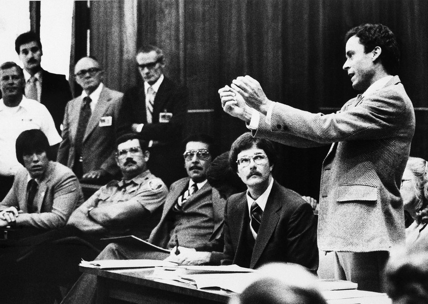 Theodore Bundy gestures as he presents a motion before Circuit Judge Edward Cowart, as Bundy's murder trial got under way in Miami on Monday, June 25, 1979. Bundy's motion complained that he could not ...