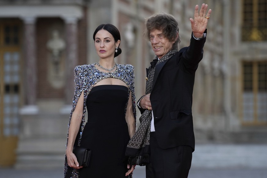 Mick Jagger and Melanie Hamrick arrive for a state dinner held in honor of King Charles III and Queen Camilla, at the Chateau de Versailles, west of Paris, Wednesday, Sept. 20, 2023. King Charles III  ...