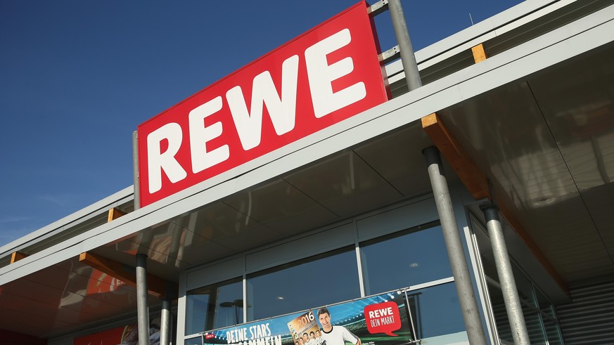 BERLIN, GERMANY - MAY 10: A Rewe supermarket branch stands on May 10, 2016 in Berlin, Germany. German anti-cartel authorities announced yesterday they are charging Rewe as well as chains Metro, Edeka  ...