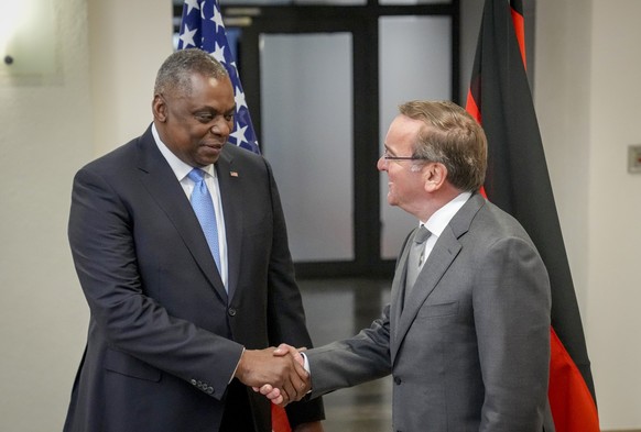 New German Defence Minister Boris Pistorius, right, and US Defense Secretary Lloyd Austin shake hands prior to a meeting at the Defence Ministry in Berlin, Germany, Thursday, Jan. 19, 2023. (AP Photo/ ...