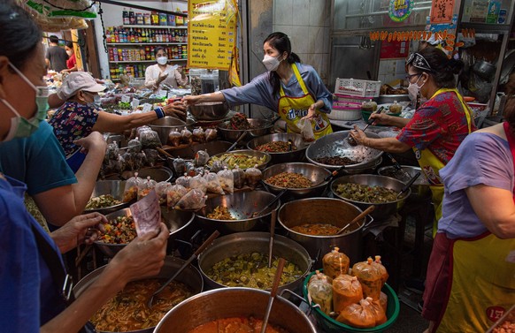 September 29, 2022, Bangkok, Thailand: Food vendors sell the vegetarian food during the festival at Yaowarat the Chinatown. The Vegetarian Festival which runs from 25th September to 4th October, worsh ...