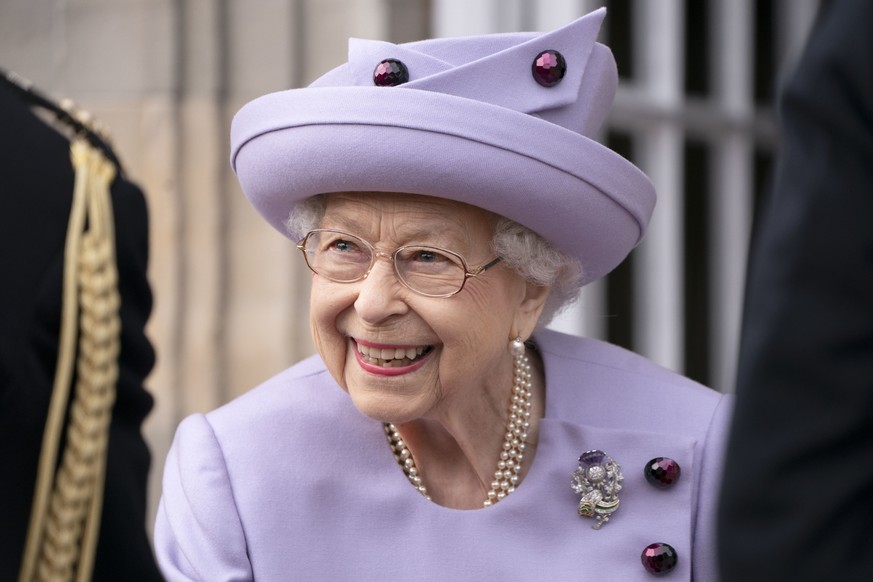 Queen Elizabeth II attends an armed forces act of loyalty parade in the gardens of the Palace of Holyroodhouse, Edinburgh, Tuesday, June 28, 2022. The event will be an opportunity for the Armed Forces ...