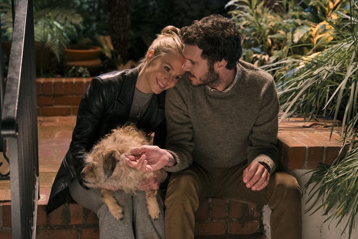This image released by Netflix shows Kristen Bell, left, and Adam Brody in a scene from &quot;Nobody Wants This.&quot; (Hopper Stone/Netflix via AP)