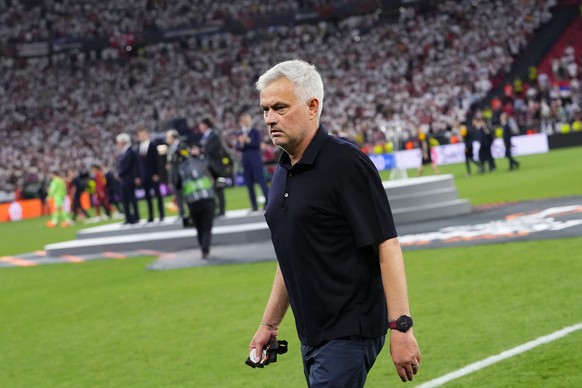 Roma's head coach Jose Mourinho walks away with his second place medal after receiving it at the end of the Europa League final soccer match between Sevilla and Roma, at the Puskas Arena in Budap ...
