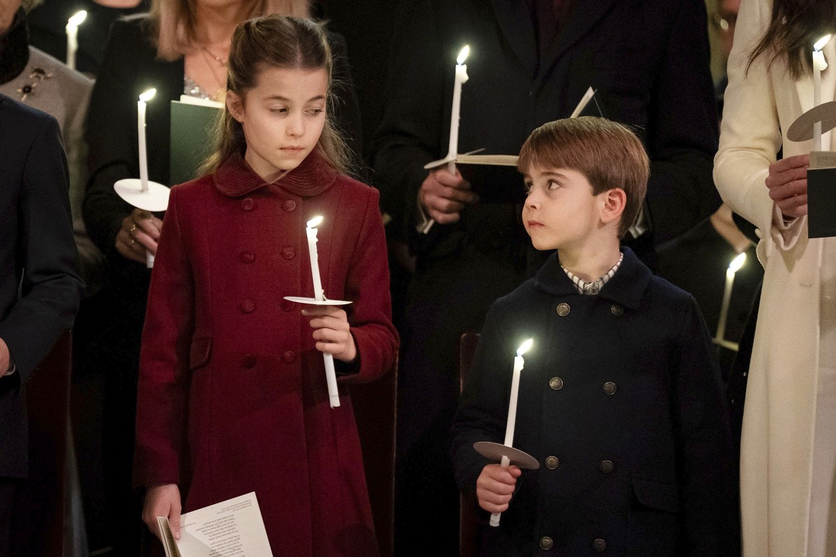 Britain's Princess Charlotte, left and Prince Louis attend the Royal Carols - Together At Christmas service, at Westminster Abbey, in London, Friday, Dec. 8, 2023. (Aaron Chown/Pool Photo via AP)