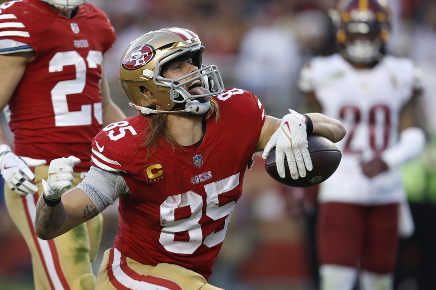 San Francisco 49ers tight end George Kittle reacts after making a catch in the second half of an NFL football game against the Washington Commanders, Saturday, Dec. 24, 2022, in Santa Clara, Calif. (A ...