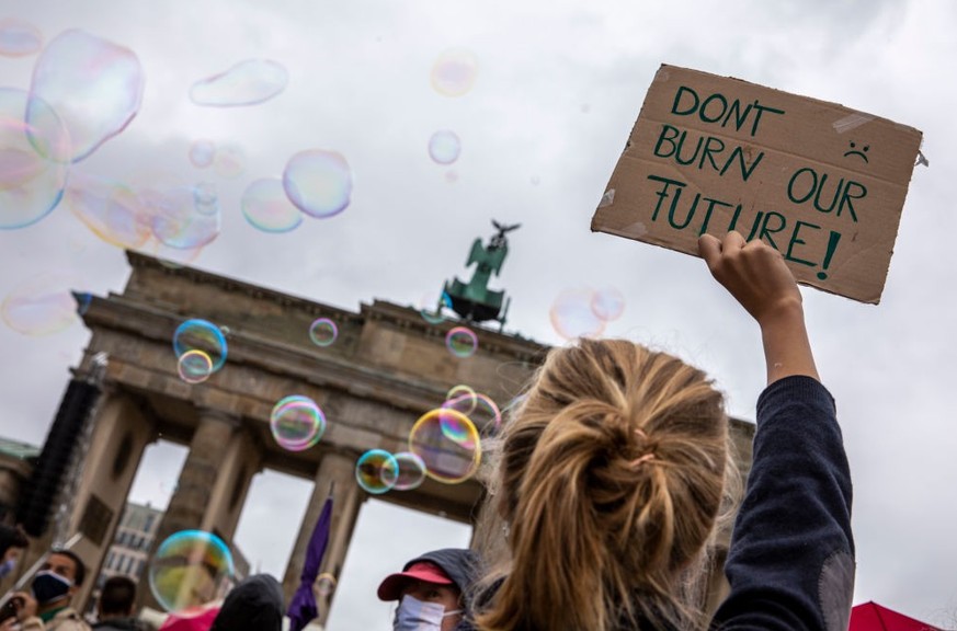 BERLIN, GERMANY - SEPTEMBER 25: Climate activists gather on a &quot;Global Day of Action&quot; organized by the Fridays for Future climate change movement during the coronavirus pandemic on September  ...