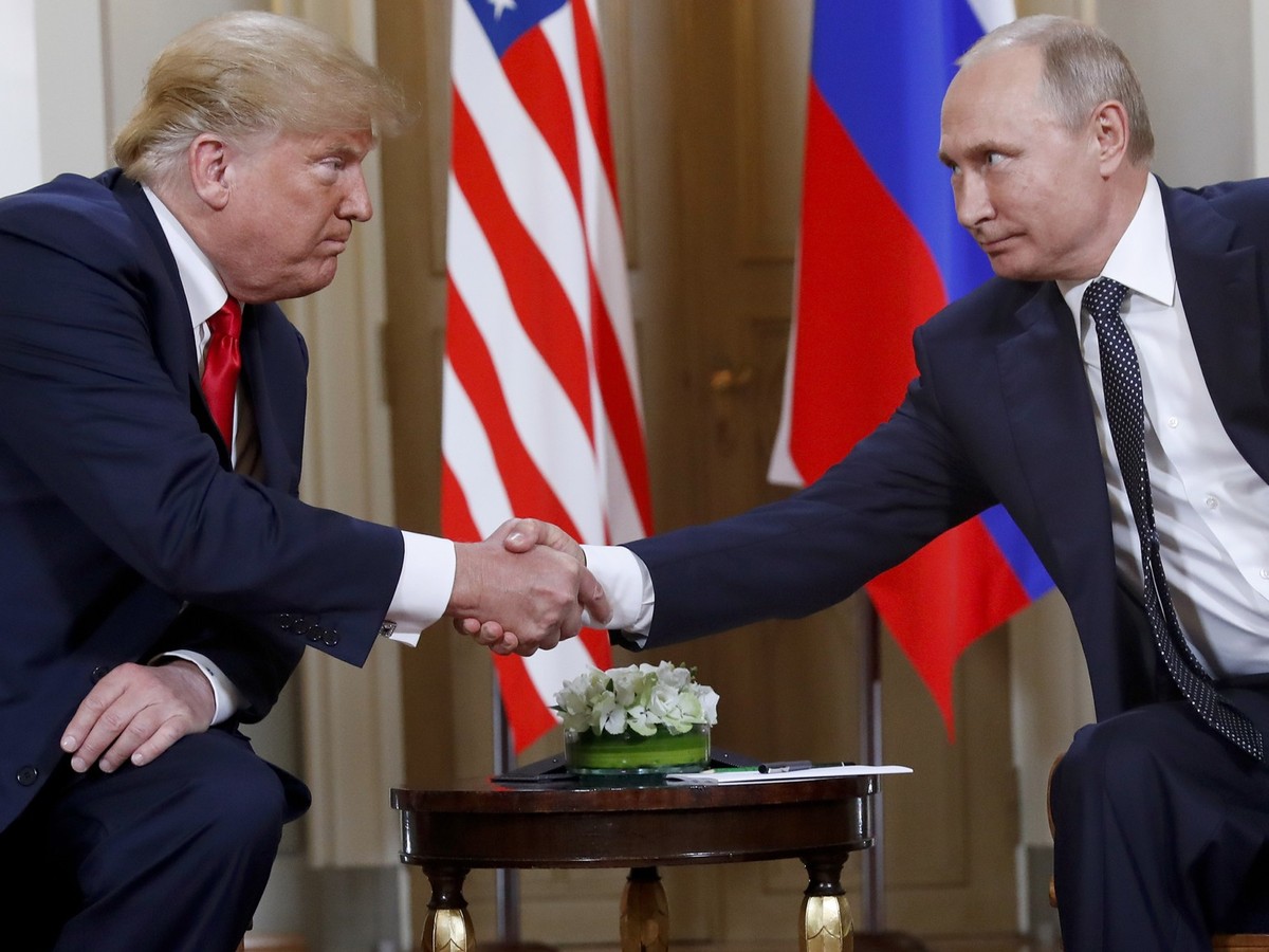 FILE - President Donald Trump, left, and Russian President Vladimir Putin shake hands at the beginning of a meeting at the Presidential Palace in Helsinki, Finland, July 16, 2018. (AP Photo/Pablo Mart ...