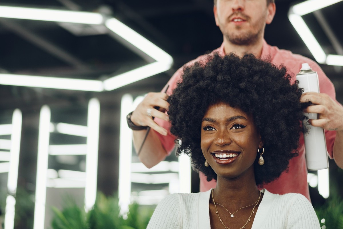 Young african woman customer getting a hairstyle at a beauty salon, portrait Model Released Property Released xkwx hair, hairdresser, woman, afro, african, black, cut, happy, hairdo, stylist, salon, b ...