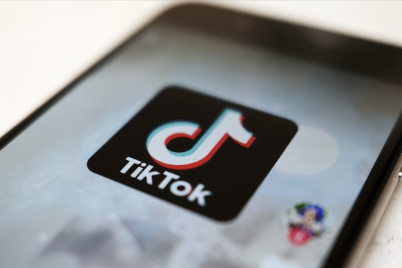 FILE - This Sept. 28, 2020, file photo, shows a TikTok logo on a smartphone screen in Tokyo. After months of testing, TikTok is fully launching its e-commerce product in the U.S., in an effort to tran ...