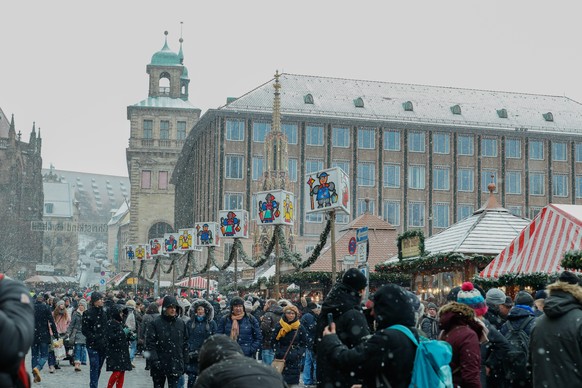 Some colored puppets. The world-famous Christmas Market of Nuremberg was full of people even if there was heavy snowfall and cold. (Photo by Alexander Pohl/NurPhoto)