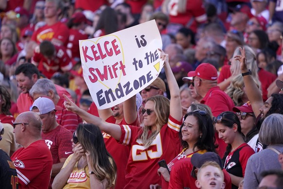 FILE - A fan holds a sign during the first half of an NFL football game between the Chicago Bears and Kansas City Chiefs Sunday, Sept. 24, 2023, in Kansas City, Mo. Eager as the National Football Leag ...