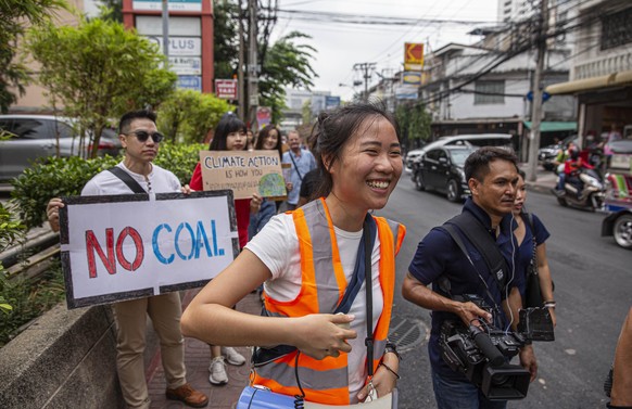 September 20, 2019, Bangkok, Thailand: Nanticha ÃLynnÃ Ocharoenchai laughs as she tries to direct protesters during the Global Climate Strike in Bangkok, Thailand. The peaceful protest demanded acti ...