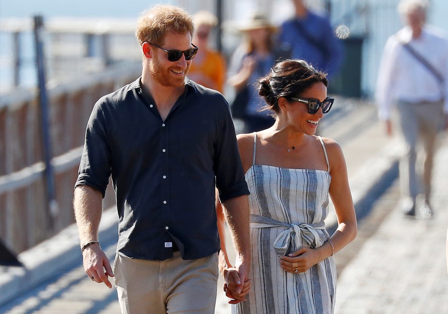 FILE PHOTO: Britain&#039;s Prince Harry and Meghan, Duchess of Sussex, arrive to greet members of the public in Kingfisher Bay on Fraser Island in Queensland, Australia October 22, 2018. REUTERS/Phil  ...