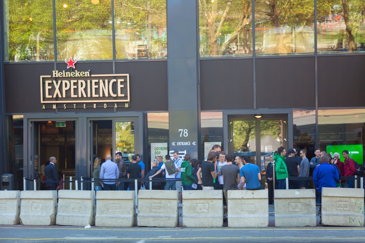 Amsterdam, Netherlands - May, 2018: The Heineken Experience brewery with visitors and tourists. Historic brewery for internationally distributed Dutch pilsner, Heineken beer in Amsterdam