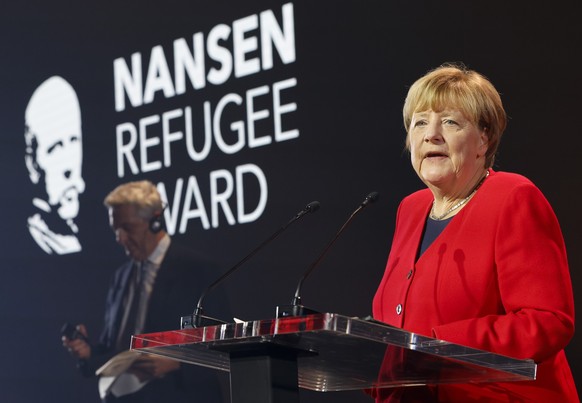 Angela Merkel speaks as she receives the UNHCR Nansen Refugee Award for protecting refugees at the height of the Syria crisis, during a ceremony in Geneva, Switzerland, Monday Oct. 10, 2022. (Stefan W ...