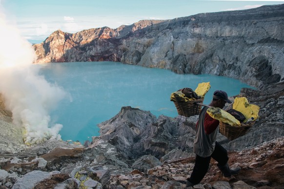 Mount Ijen, which contains the world&#039;s largest acidic crater lake, is home to sulfur mining, where Indonesian workers work in harsh conditions. Model Released Property Released xkwx nature landsc ...