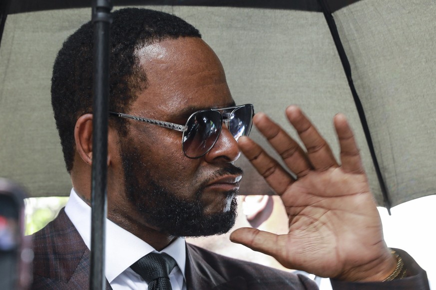 FILE - In this June 26, 2019, file photo, musician R. Kelly departs from the Leighton Criminal Court building after a status hearing in his criminal sexual abuse trial in Chicago. On Wednesday, Dec. 4 ...