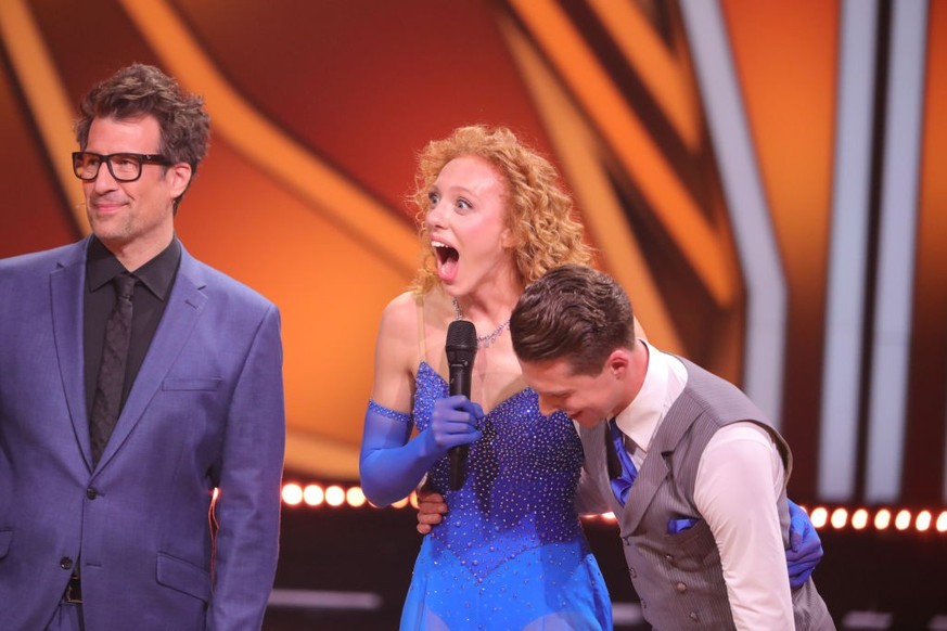 COLOGNE, GERMANY - MARCH 24: Host Daniel Hartwich and contestants Anna Ermakova and Valentin Lusin react on stage during the fifth &quot;Let&#039;s Dance&quot; show at MMC Studios on March 24, 2023 in ...