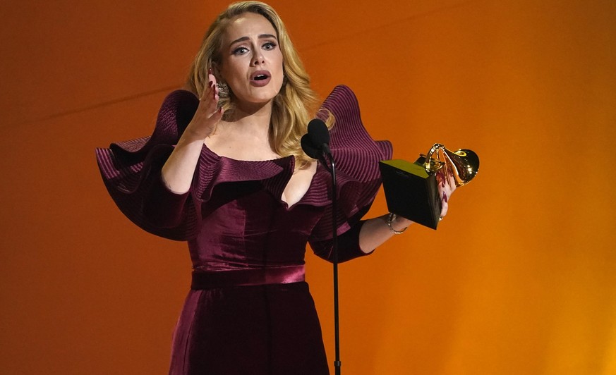 Adele accepts the award for best pop solo performance for &quot;Easy On Me&quot; at the 65th annual Grammy Awards on Sunday, Feb. 5, 2023, in Los Angeles. (AP Photo/Chris Pizzello)