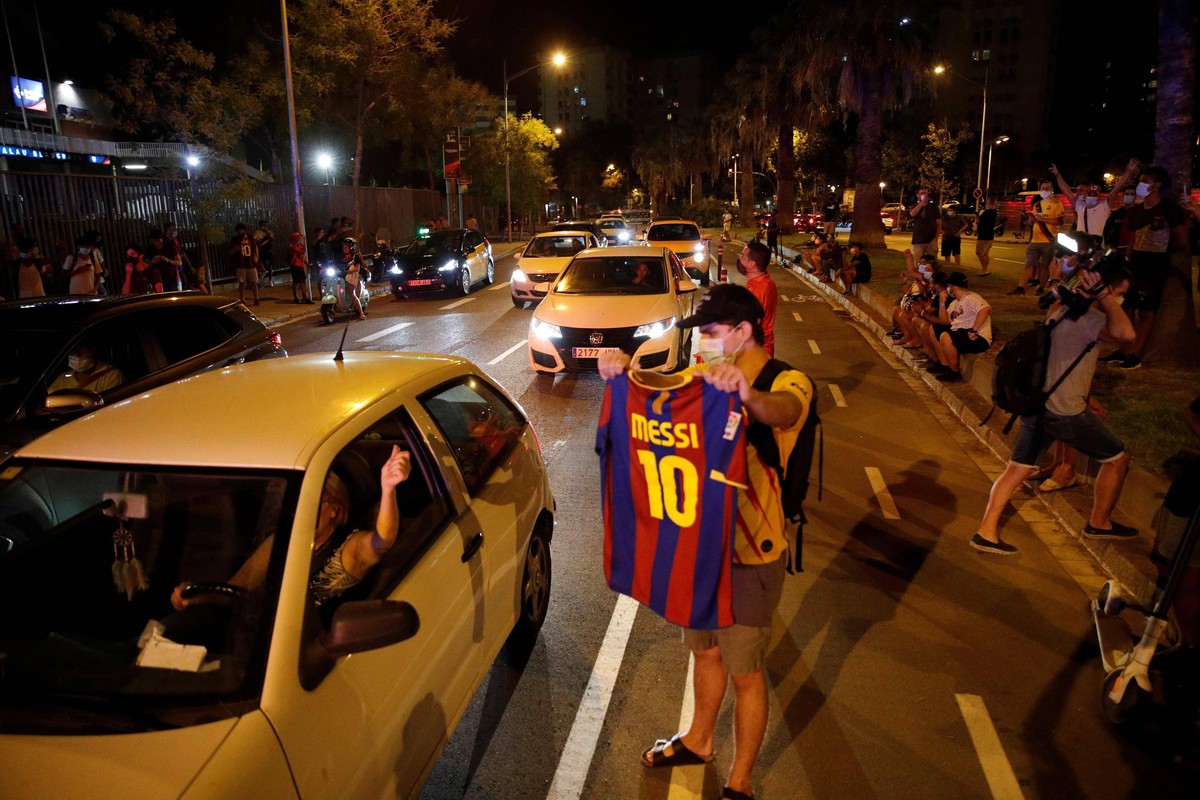 Dozens of FC Barcelona, Barca fans gather outside Camp Nou Stadium to demand the resignation of the club s president, Josep Maria Bartomeu, after Argentinian star Lionel Messi stated via fax his inten ...