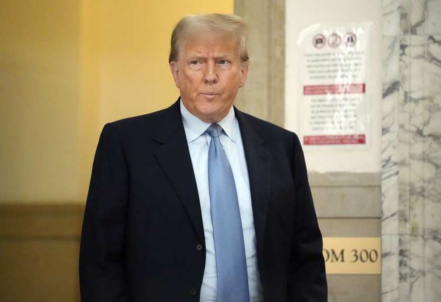 Former President Donald Trump returns to the courtroom after a break of his civil business fraud trial at New York Supreme Court, Wednesday, Oct. 18, 2023, in New York. (AP Photo/Seth Wenig)