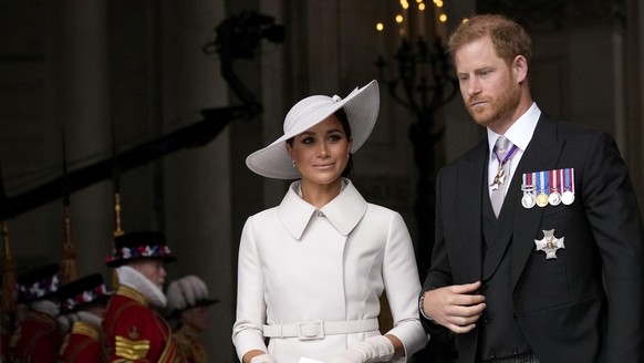 Prince Harry and Meghan Markle, Duke and Duchess of Sussex leave after a service of thanksgiving for the reign of Queen Elizabeth II at St Paul's Cathedral in London, Friday, June 3, 2022 on the secon ...