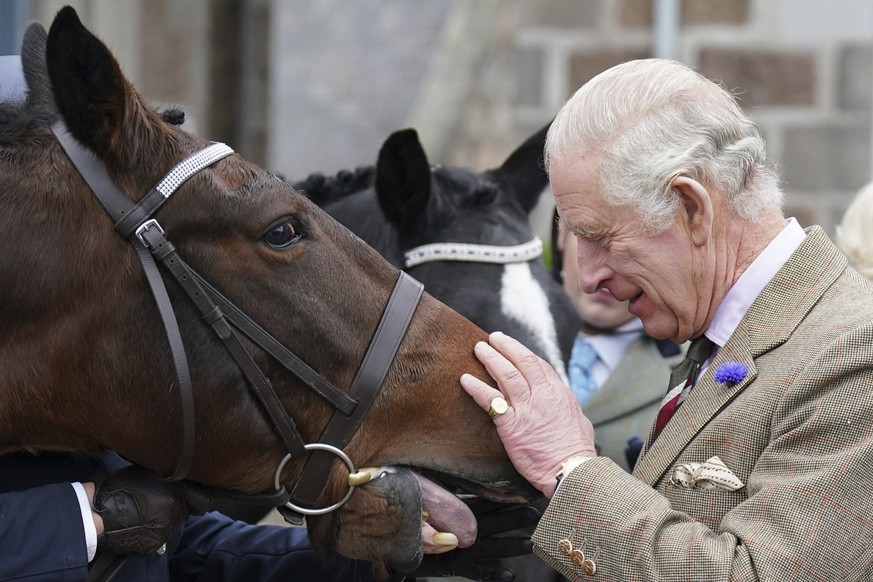 King Charles III feeds carrots to horses as he attends a reception to thank the community of Aberdeenshire for their organisation and support following the death of Queen Elizabeth II at Station Squar ...