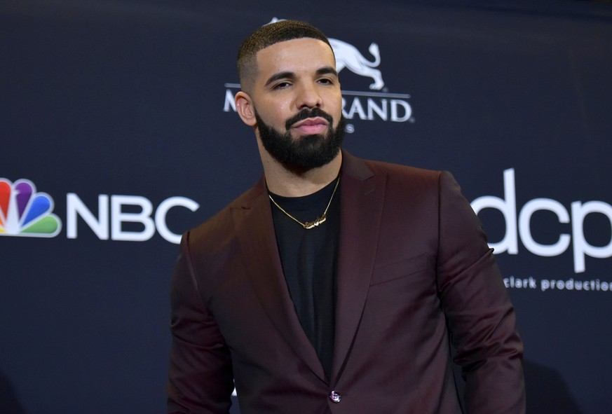 FILE - Drake poses for a photograph at the Billboard Music Awards, May 1, 2019, in Las Vegas. Hip-hop artist Drake, who had been sued for his participation in the deadly 2021 Astroworld festival in Ho ...