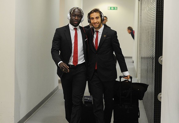 LONDON, ENGLAND - MAY 4: (L-R) Bacary Sagna and Mathieu Flamini walk into the Arsenal changing room before the Barclays Premier League match between Arsenal and West Bromwich Albion at Emirates Stadiu ...