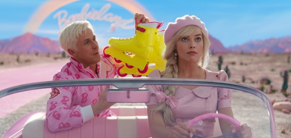 This image released by Warner Bros. Pictures shows Ryan Gosling, left, and Margot Robbie in a scene from &quot;Barbie.&quot; (Warner Bros. Pictures via AP)