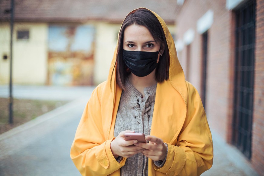 Portrait of young woman wearing 2.5PM face mask