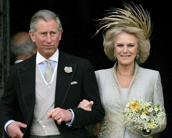 FILE - Britain&#039;s Prince Charles and his bride Camilla Duchess of Cornwall as they leave St George&#039;s Chaple in Windsor, England, April 9, 2005 following the church blessing of their civil wed ...