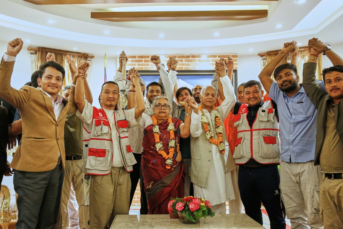 &quot;Gen Z&quot; leaders and others raise their hands with former Supreme Court Chief Justice Sushila Karki, center, after she was sworn in as interim prime minister at the presidential residence in  ...