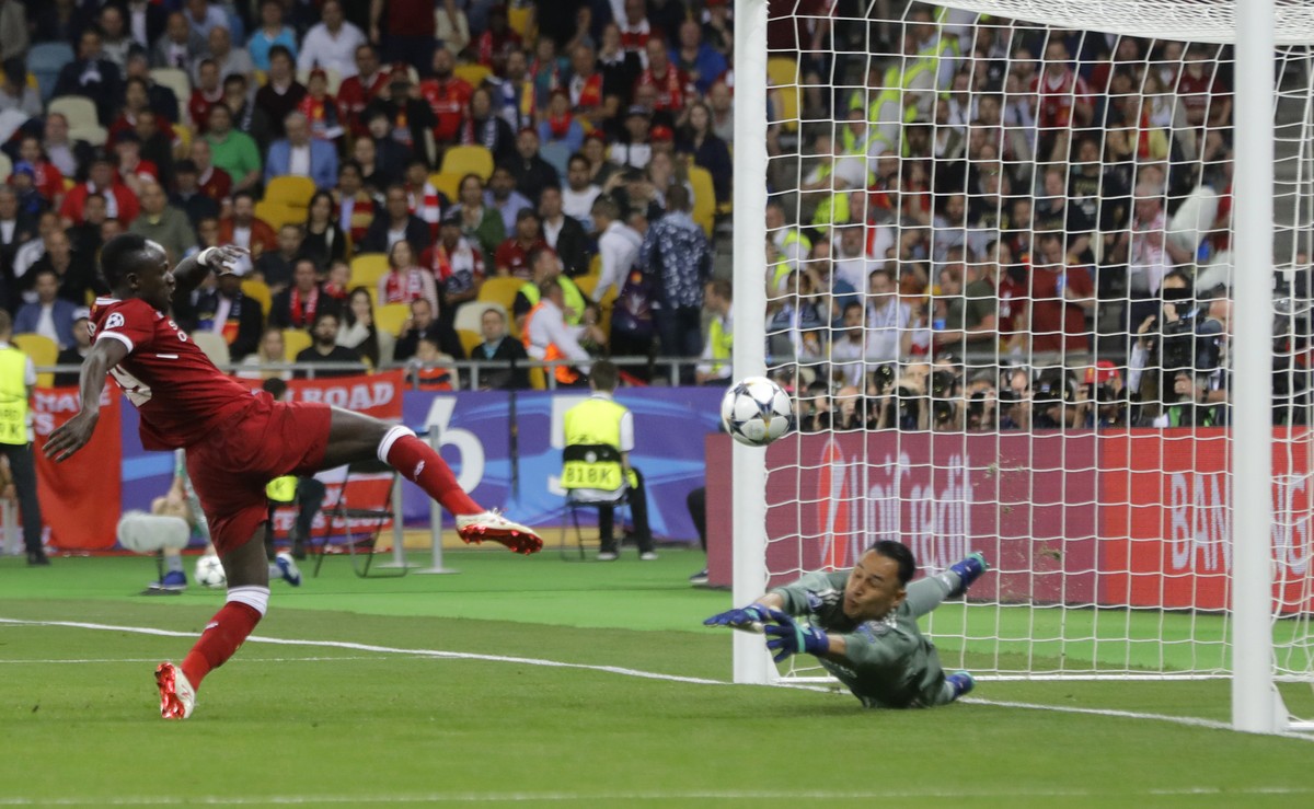 Liverpool&#039;s Sadio Mane, left, scores his side&#039;s opening goal past Real Madrid&#039;s goalkeeper Keylor Navas during the Champions League Final soccer match between Real Madrid and Liverpool  ...