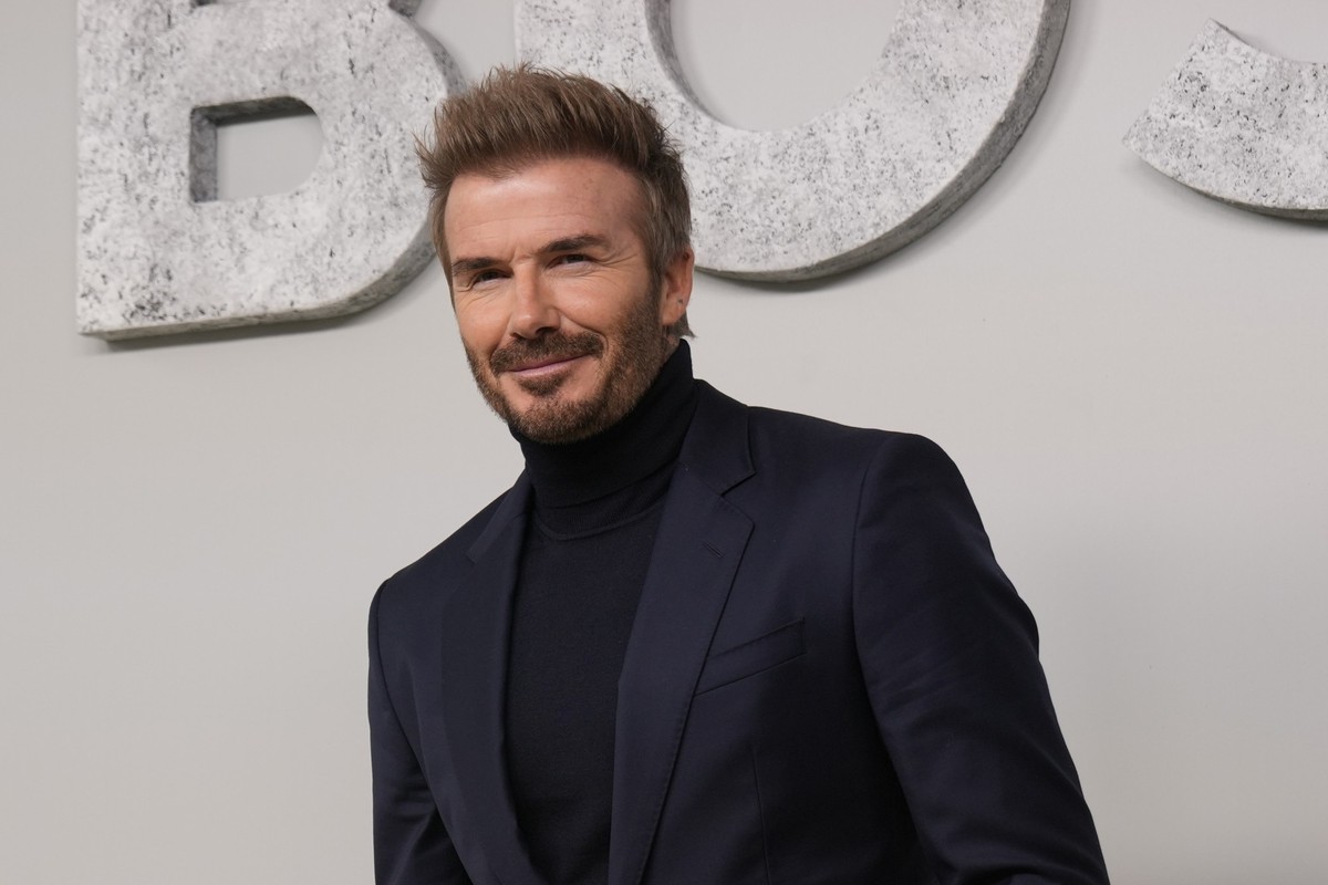 Former soccer star David Beckham attends the Boss Spring Summer 2025 fashion show, that was presented in Milan, Italy, Wednesday, Sept. 18, 2024. (AP Photo/Antonio Calanni).