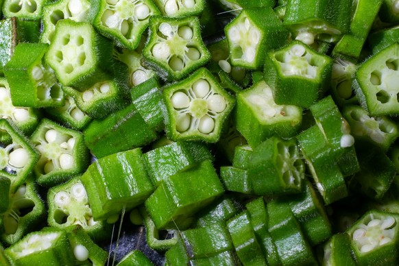cut pieces of Okra. closeup photo. Model Released Property Released xkwx okra vegetable cut fresh green food healthy raw nature diet vegetarian slice ingredient white isolated fruit lady finger backgr ...