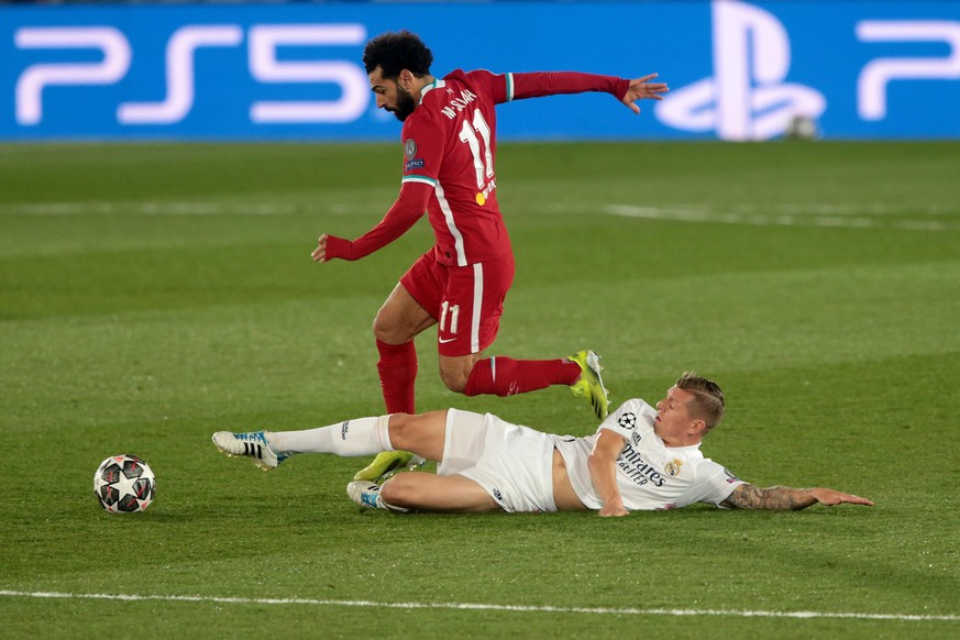 Madrid Spain; 06.04.2021.- Real Madrid against Liverpool Champions League quarter-finals 1st leg match held at the Alfredo Di Stefano Stadium in Madrid. Real Madrid player Toni Kroos (R) figth the bal ...