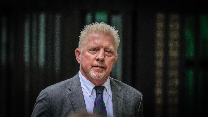 London, UK, 29th April 2022. Former tennis ace Boris Becker, with girlfriend Lilian de Carvalho, walks up to Southwark Crown Court where he is due to be sentenced today. Becker is facing the potential ...